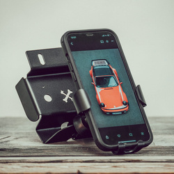 CarBone central console delete panel with a phone charger holder